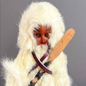 Vintage Inuit Doll with Fur Coat and Wooden Accessory
